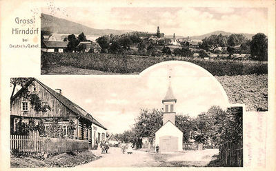 AK-Hirndorf-Strassenpartie-mit-Kirche-Blick-auf-den-Ort.jpg