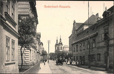AK-Bodenbach-Rosawitz-Strassenpartie-mit-Kirche-und-Kutsche.jpg